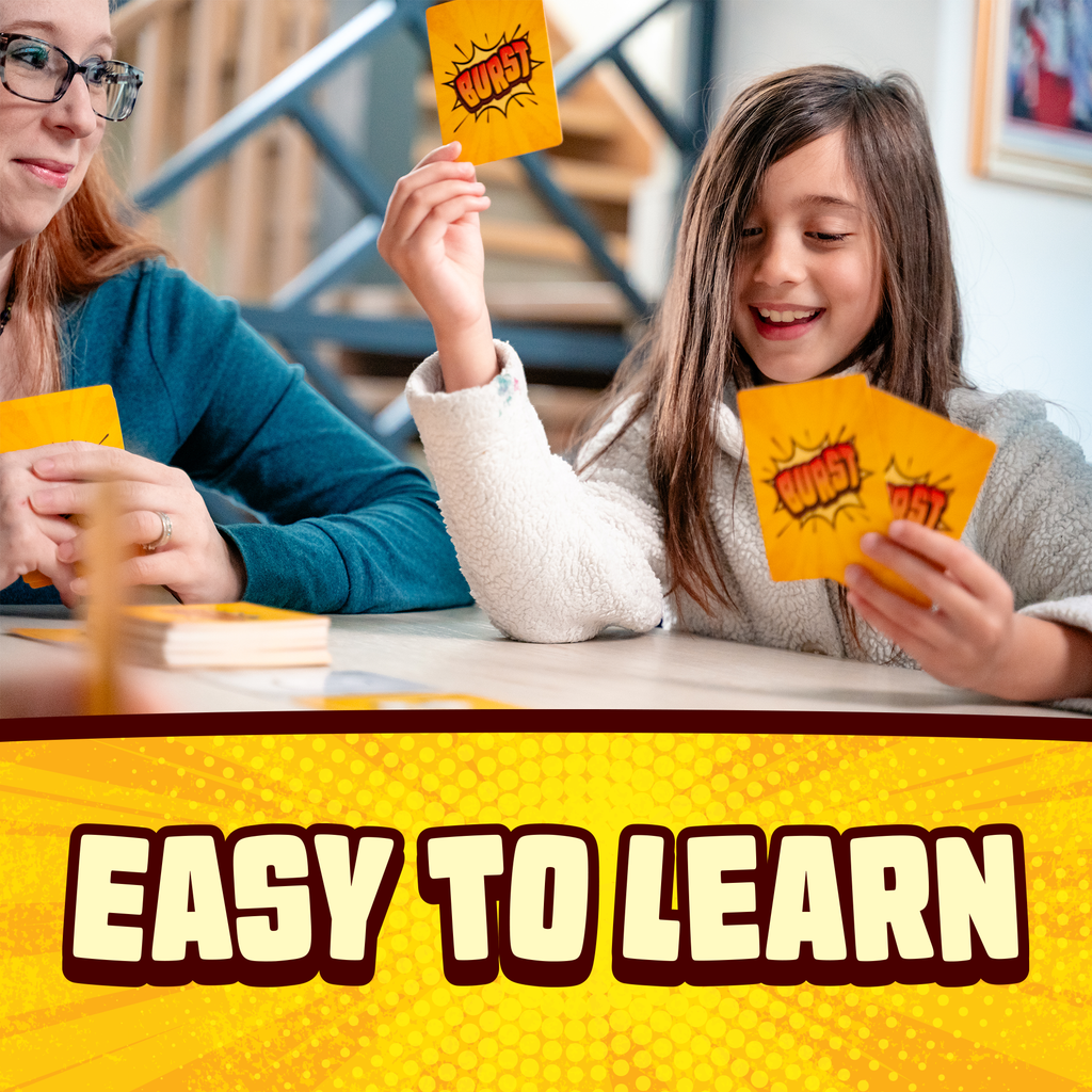 Two people playing a card game with 'WOW' cards, sitting at a table indoors. card game, educational game, family fun, game night, travel games