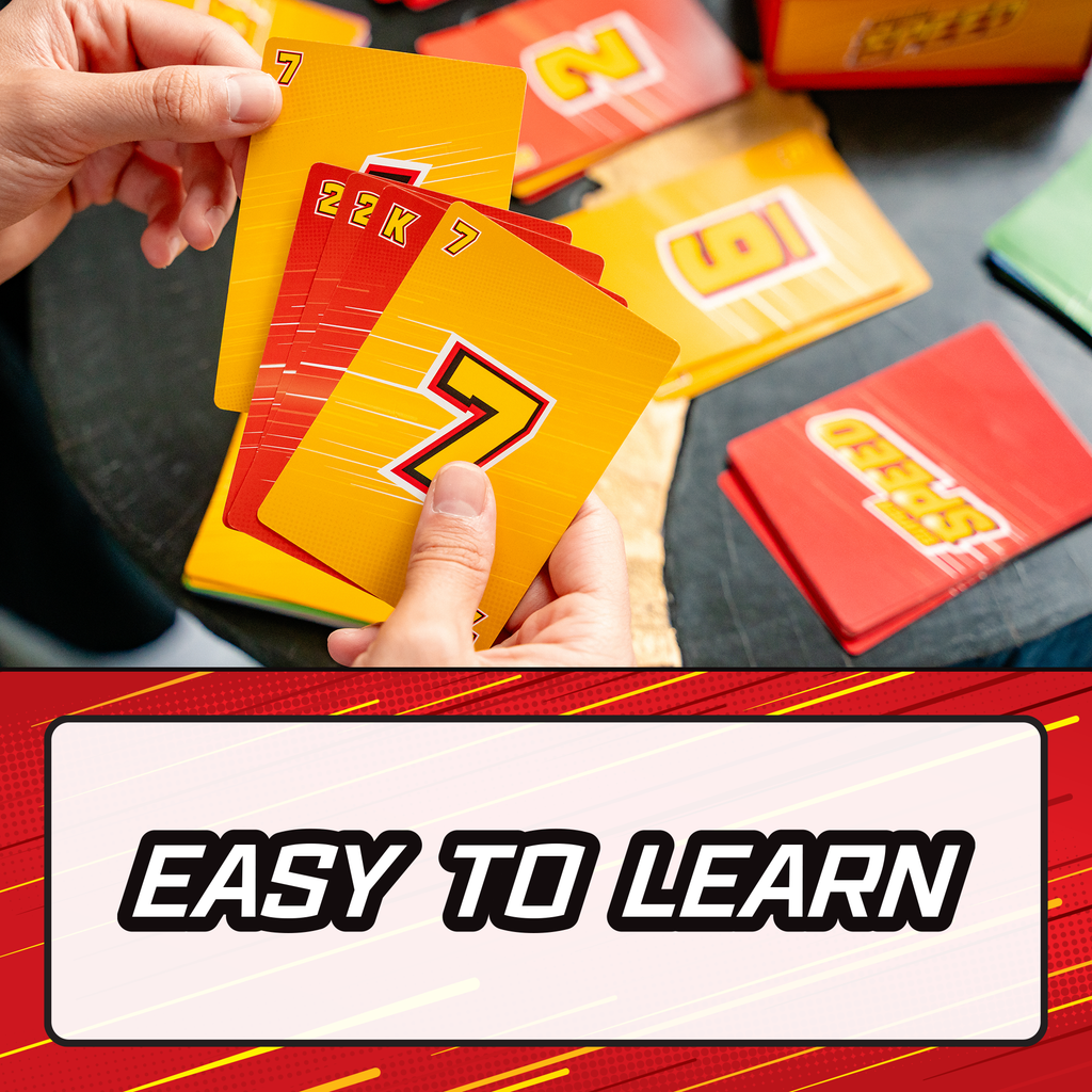A close-up of hands holding a fan of colorful educational cards, with more cards scattered on a dark tabletop. A large text banner at the bottom reads 'EASY TO LEARN'. speed family fun card game